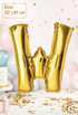 Gold Letter W foil balloon 32 inch (81 cm) metallic alphabet balloon for birthday, wedding, baby shower, anniversary, party decoration, and same-day balloon delivery in Dubai.